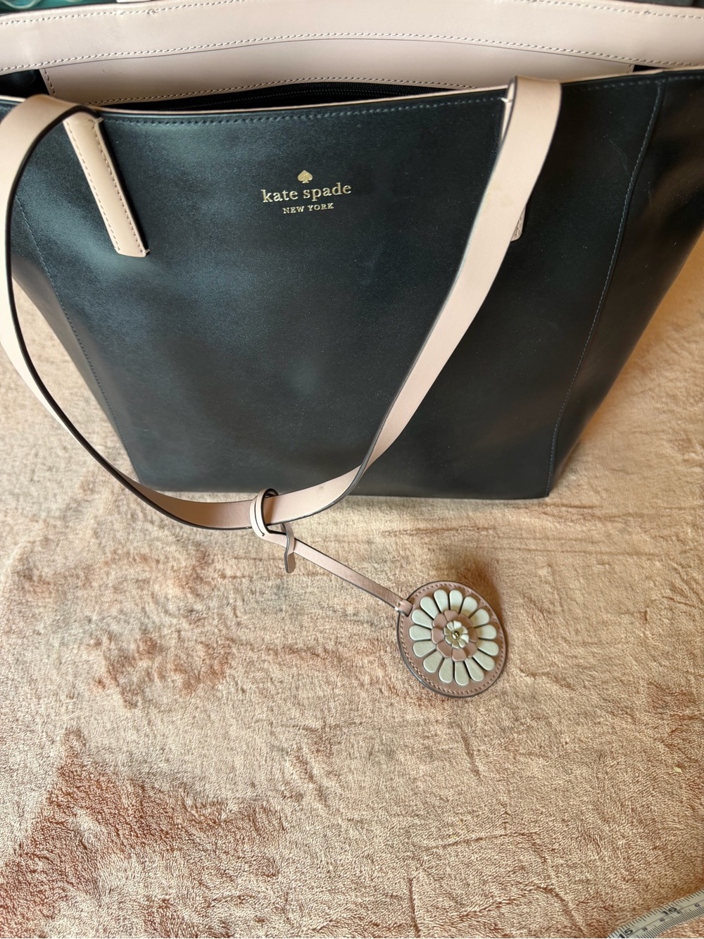 kate spade black tote with cream straps and floral charm